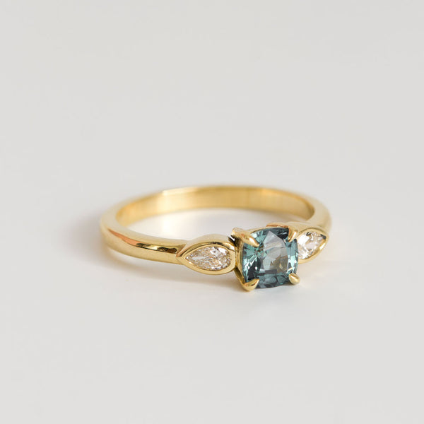 Teal Cushion Cut Sapphire with Pear Diamonds in 18ct Yellow Gold
